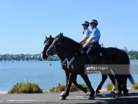 SYDNEY, AUSTRALIA - APRIL 23: Two Police officers riding their horses are seen patrolling The Bay Run on April 23, 2020 in Sydney, Australia. Police have been patrolling the popular exercise path to ensure people are observing social distancing rules in place to stop the spread of COVID-19. All non-essential business have been closed or are restricted in operation in place in response to the COVID-19 pandemic, while public gatherings are limited to two people and social distancing measures require people to keep a safe 1.5m distance from one another.  New South Wales and Victoria have enacted additional lockdown measures to allow police the power to fine people who breach the two-person outdoor gathering limit or leave their homes without a reasonable excuse. Queensland, Western Australia, South Australia, Tasmania and the Northern Territory have all closed their borders to non-essential travellers and international arrivals into Australia are being sent to mandatory quarantine in hotels for 14 days. (Photo by Saverio Marfia/Getty Images)