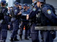 SYDNEY, AUSTRALIA - DECEMBER 15:  Police confer on Philip St near the Lindt Cafe, Martin Place on December 15, 2014 in Sydney, Australia.  Police attend a hostage situation at Lindt Cafe in Martin Place.  (Photo by Mark Metcalfe/Getty Images)