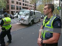 MELBOURNE, AUSTRALIA - MAY 19:  The police van transporting the five men who allegedly planned to travel by boat to Indonesia so they could join Islamic State in Syria arrives at Melbourne Magistrates Court on May 19, 2016 in Melbourne, Australia. Five Australian men were extradited from Cairns to Melbourne after being arrested near Laura last week and charged with making preparations for incursions into foreign countries to engage in hostile activities. The men were allegedly attempting to flee to Australia by boat to join Islamic State efforts in Syria.  (Photo by Scott Barbour/Getty Images)
